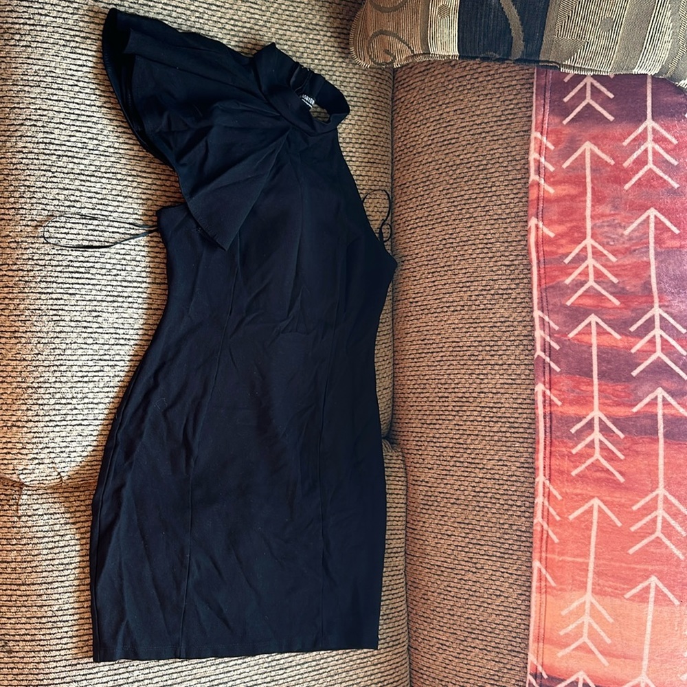 Medium ruffled one shoulder black dress.